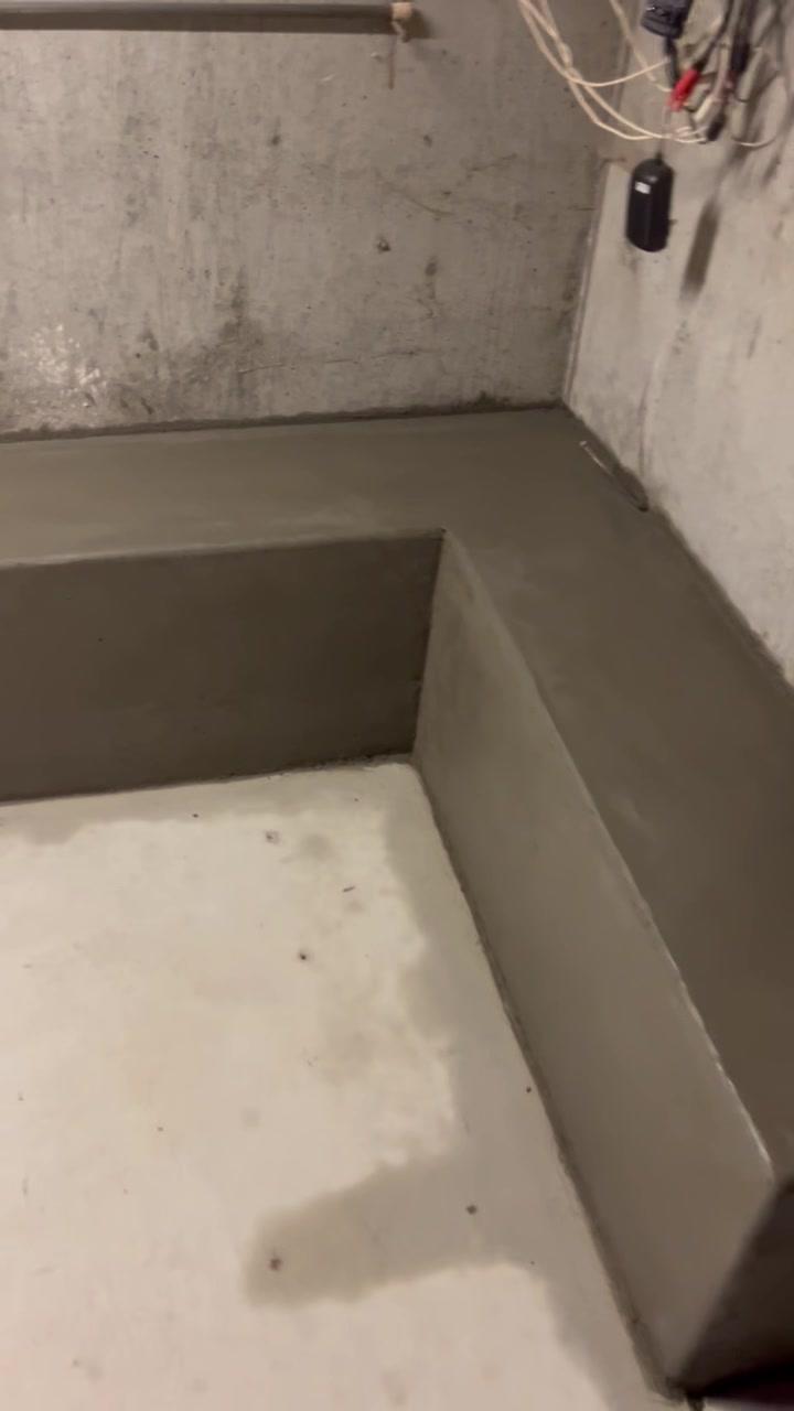 Formed concrete curb along a basement wall from a Portland-area basement repair