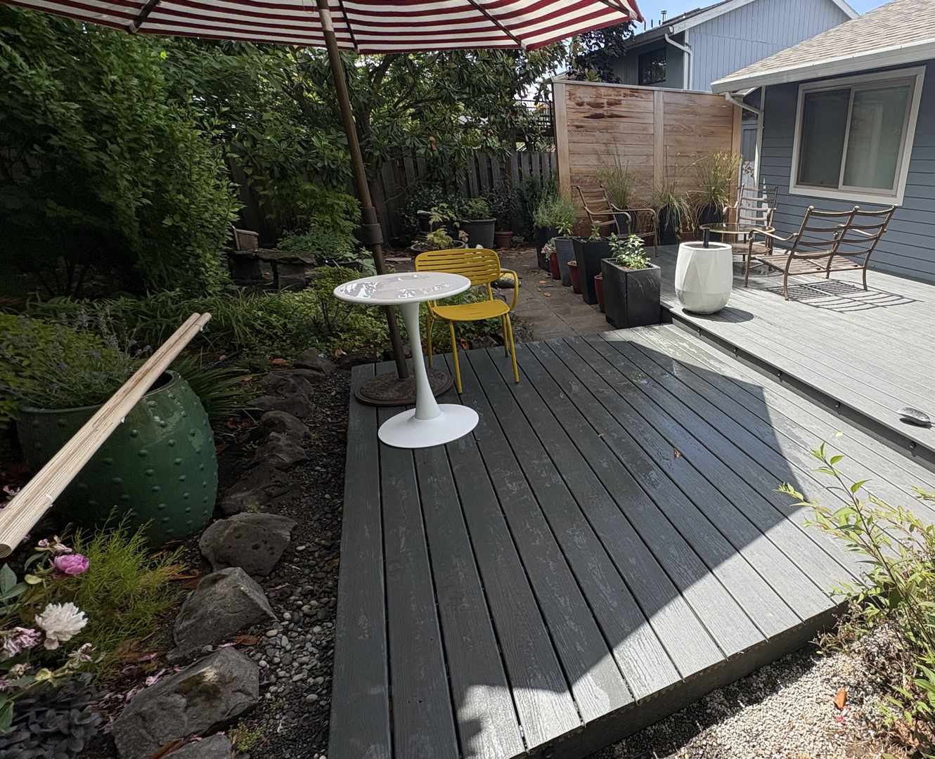 Finished gray composite deck in a Portland backyard