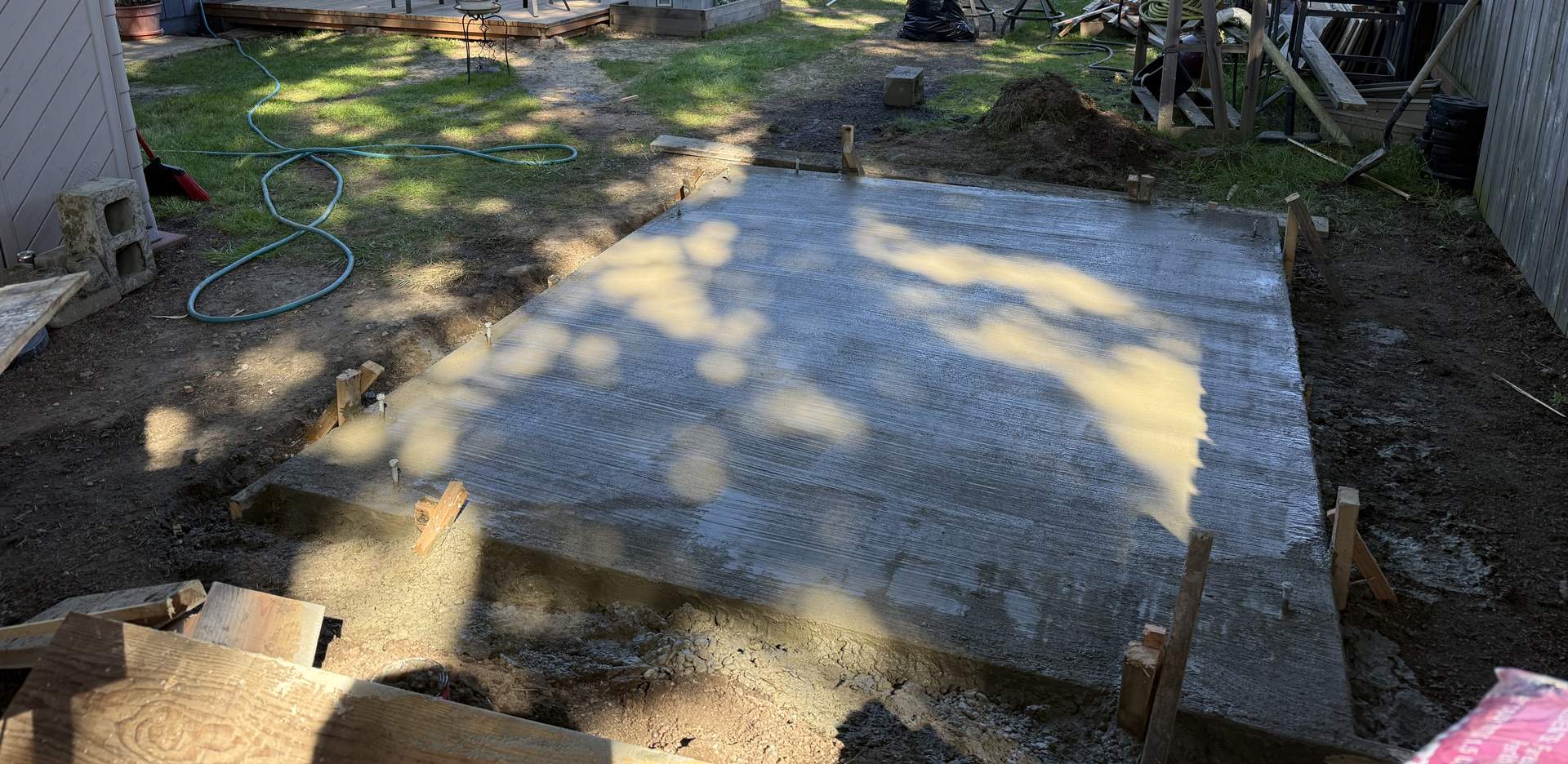 New concrete patio slab poured in a Portland backyard