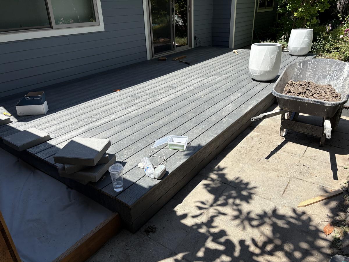 Composite deck boards being installed on a Portland deck build