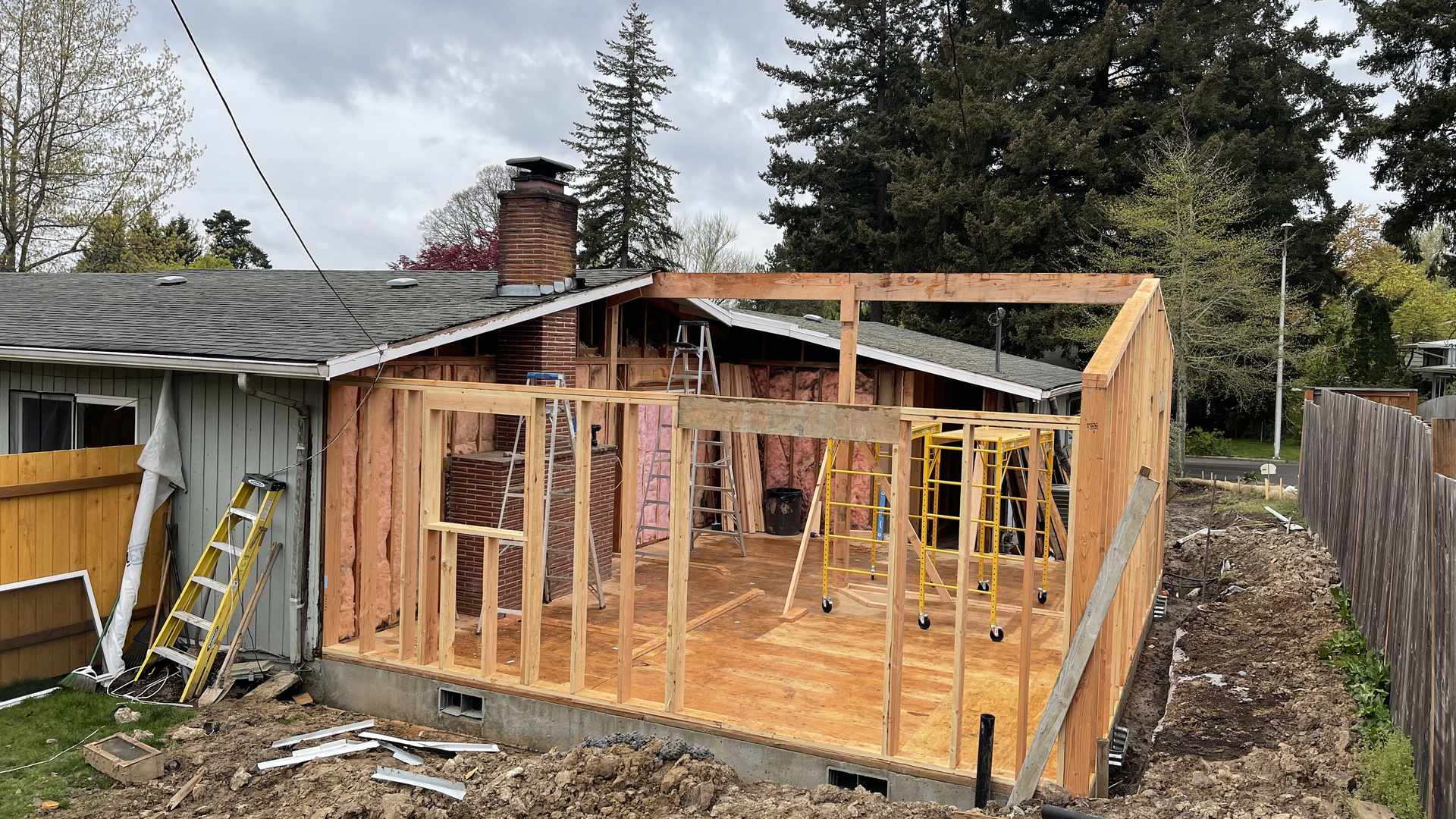 Wall framing going up on a new subfloor for a Portland house addition