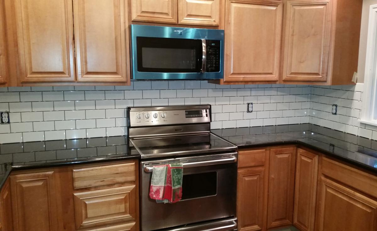 Kitchen remodeling services in Portland: new cabinets and subway tile backsplash