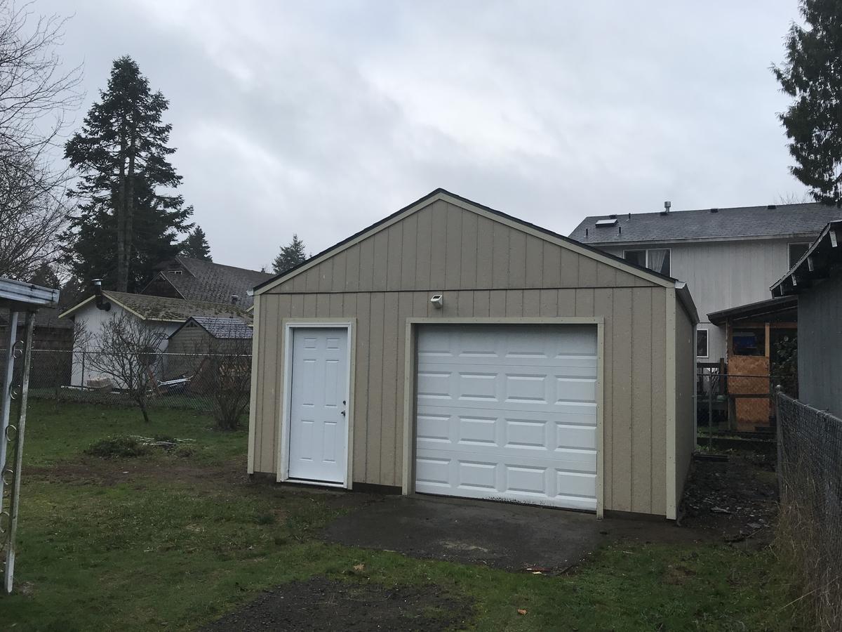 New detached garage with roll-up door built in Portland
